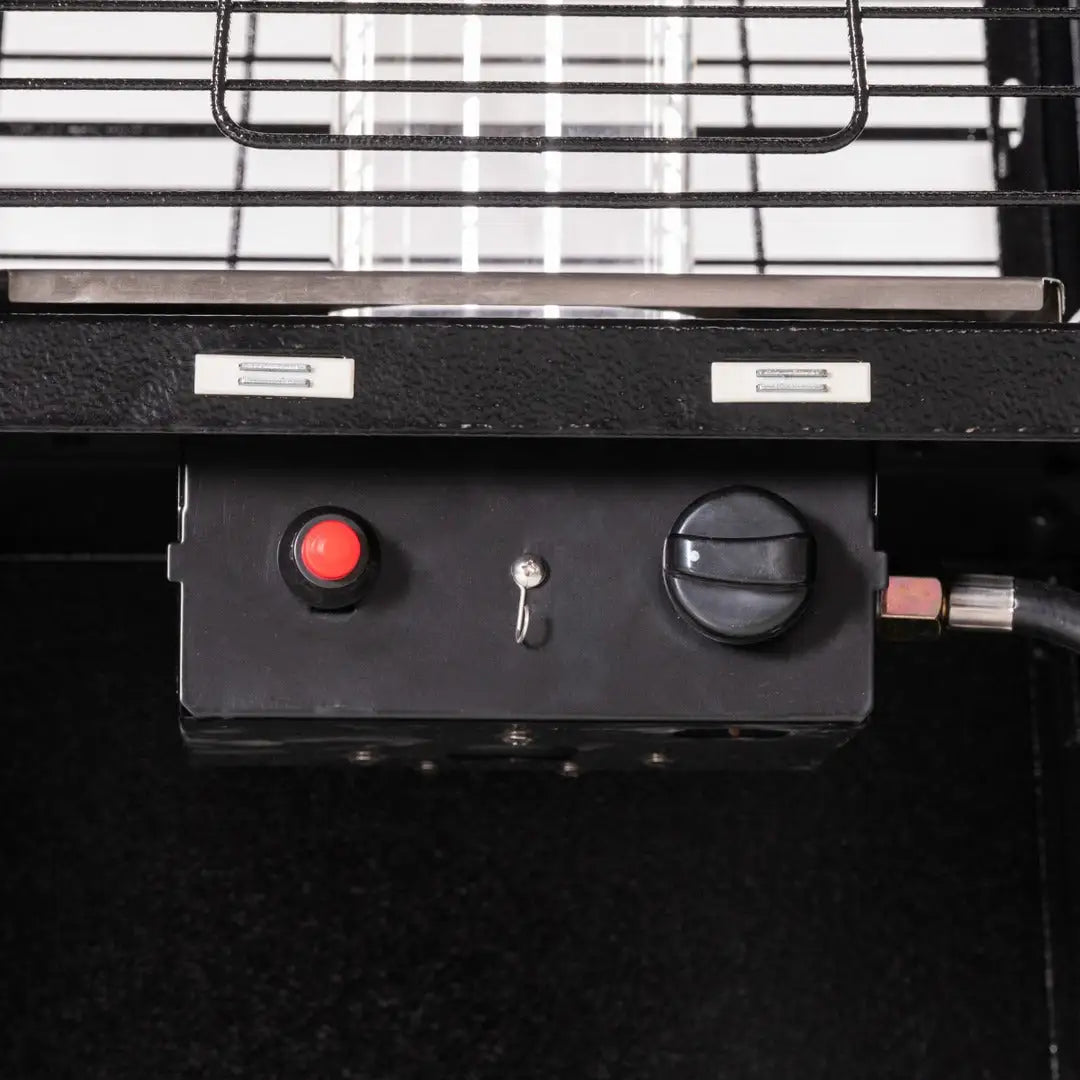 Close-up of the Legacy Heating CAPH-GT-S N pyramid flame patio heater control panel with a red ignition button and black heat adjustment knob.