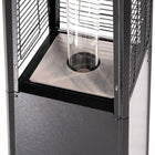 Close-up of the glass flame tube, stainless steel burner base, and protective frame on the Legacy Heating CAPH-GT-S N hammered black pyramid patio heater.
