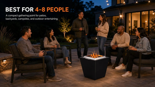 Six adults gather at a safe distance around a black LEGACY HEATING 20-inch Flat Smokeless Fire Pit during a relaxed backyard patio evening, illustrating its suitability for groups of 4–8 people.