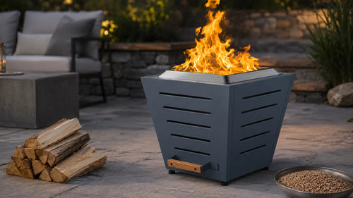 Haze Blue Legacy Heating 20-inch slatted smokeless fire pit burning dry firewood on a backyard patio, with split logs and wood pellets shown as separate fuel options.
