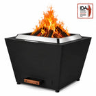 LEGACY HEATING 25 Inch Black Flat Smokeless Fire Pit with burning firewood, solid inverted-pyramid steel panels, a raised stainless steel fire ring, and a pull-out ash pan with a wooden handle.