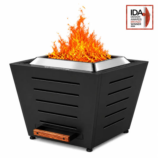 Legacy Heating 25-inch black slatted smokeless fire pit with five-groove panels, a stainless steel Fire Ring, a removable ash pan, and a burning flame.