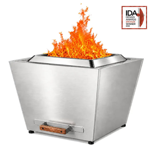Legacy Heating 25-inch stainless steel flat smokeless fire pit with a bright polished finish, Fire Ring, folding handle, wood-handled ash pan, and active flame.